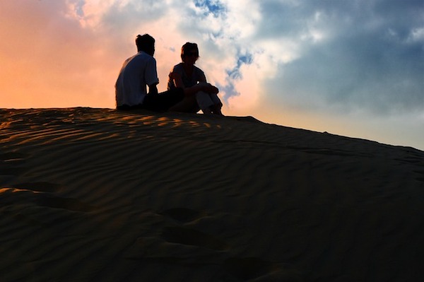 Couple at sunset - https://www.maxpixel.net/Sunset-Dusk-Sky-Desert-Shadow-Silhouette-Human-3193343